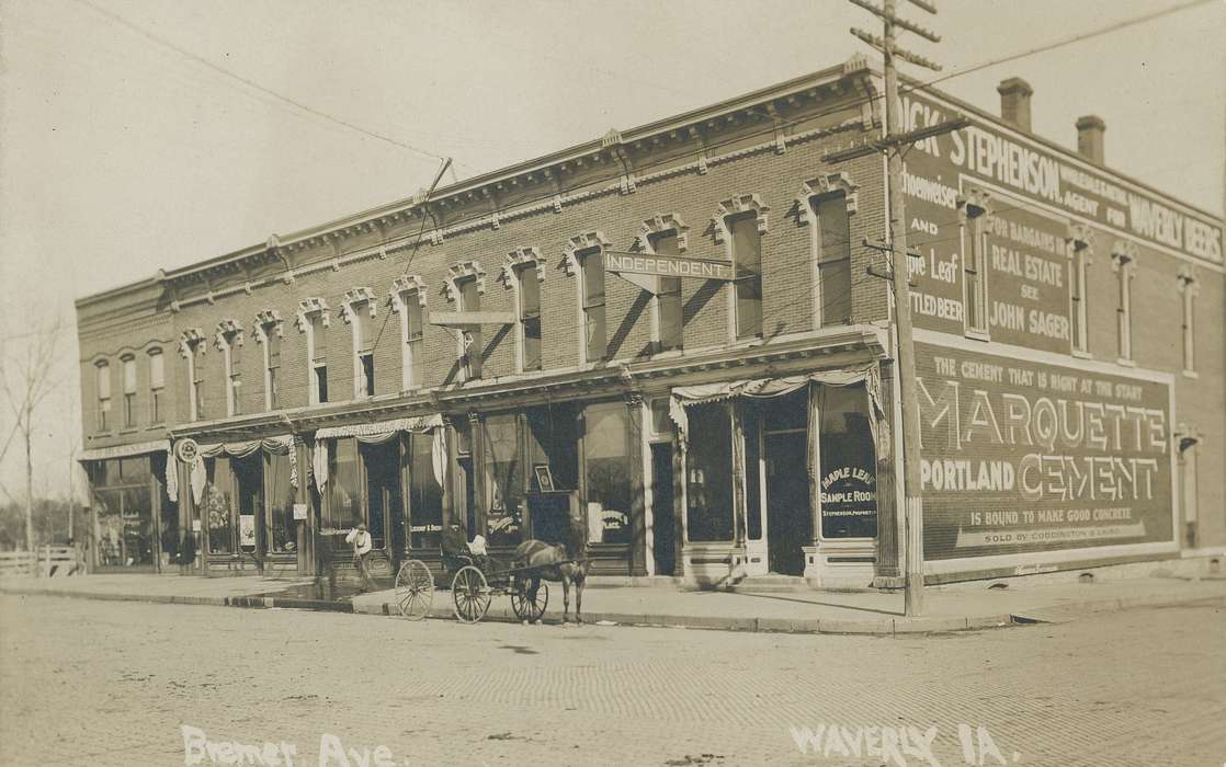 history of Iowa, Businesses and Factories, Waverly, IA, telephone pole, Main Streets & Town Squares, window display, Iowa, Waverly Public Library, awning, brick building, Iowa History, horse and buggy, correct date needed, Cities and Towns, e. bremer ave., Animals