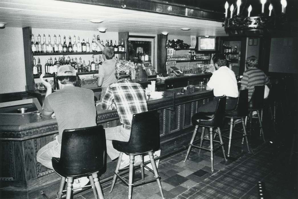 Waverly Public Library, history of Iowa, Iowa History, plaid shirt, shelf, bottle, bar, Businesses and Factories, barstool, alcohol, cash register, Iowa, baseball cap, counter, building interior, Labor and Occupations
