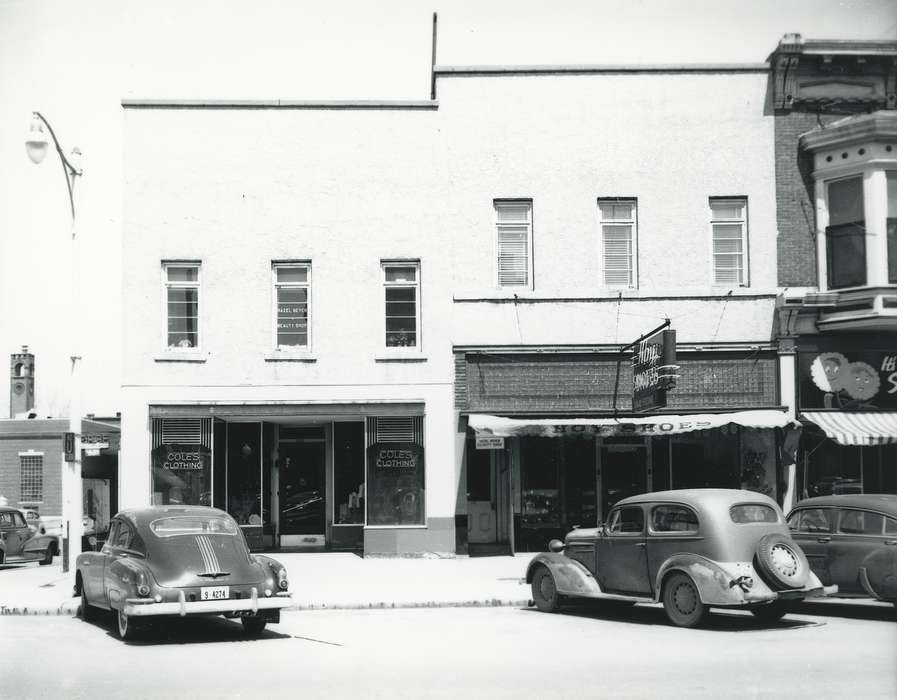 Waverly, IA, license plate, window display, history of Iowa, Motorized Vehicles, brick building, Main Streets & Town Squares, window, Iowa, Cities and Towns, car, sign, Waverly Public Library, Businesses and Factories, building, clothing store, Iowa History