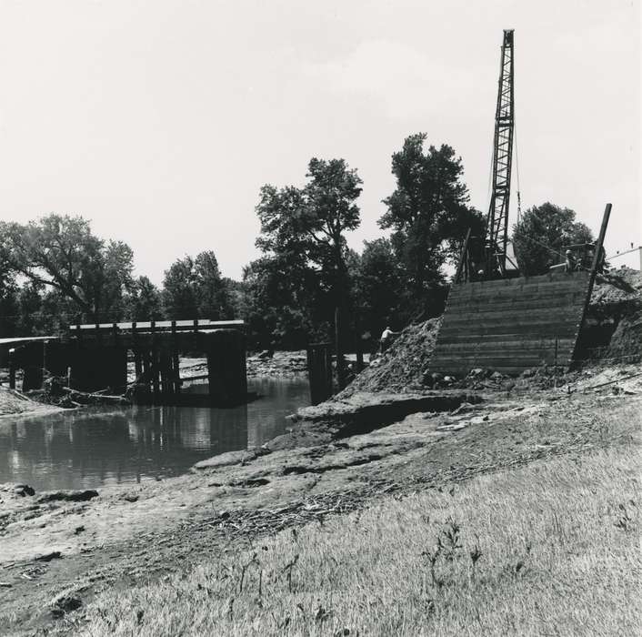construction materials, hard hat, river, Waverly Public Library, Floods, crane, bridge, Iowa History, history of Iowa, summer, Motorized Vehicles, Lakes, Rivers, and Streams, wood panel, Waverly, IA, cedar river, Iowa, tree, people, construction, construction crew, Labor and Occupations