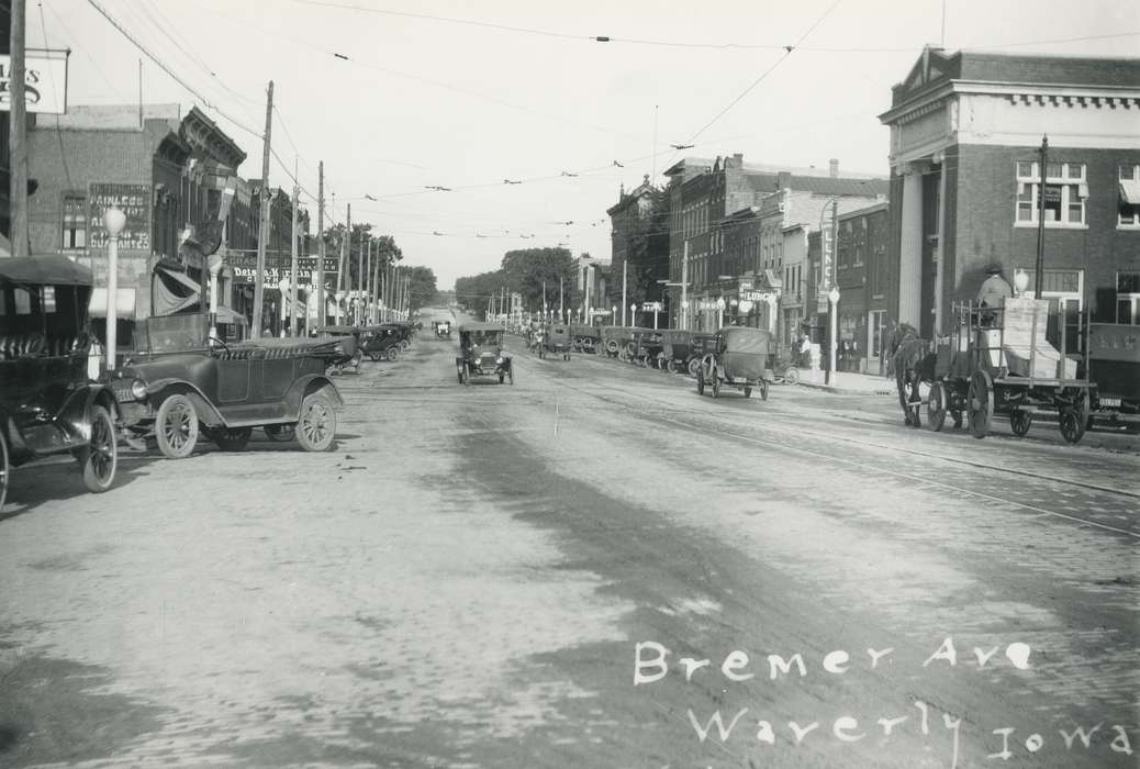 streetlights, Animals, car, horse drawn wagon, sign, Cities and Towns, horse, Waverly Public Library, license plate, Main Streets & Town Squares, history of Iowa, Iowa History, Motorized Vehicles, road, Waverly, IA, Iowa, electrical line, correct date needed, wheel
