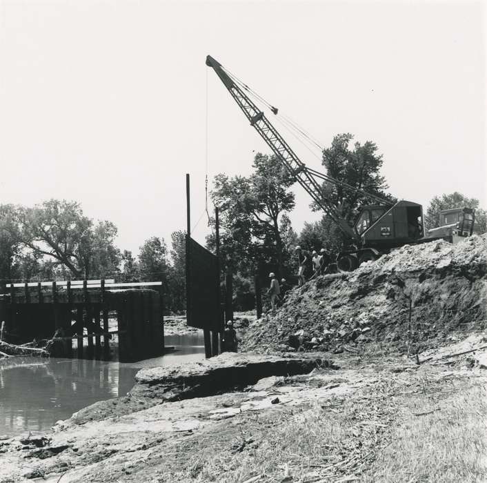 history of Iowa, Waverly Public Library, Iowa, river, Motorized Vehicles, construction crew, Iowa History, Floods, flood aftermath, cedar river, summer, construction, crane, construction materials, bridge, Waverly, IA, tree, hard hat, people, Lakes, Rivers, and Streams, Labor and Occupations