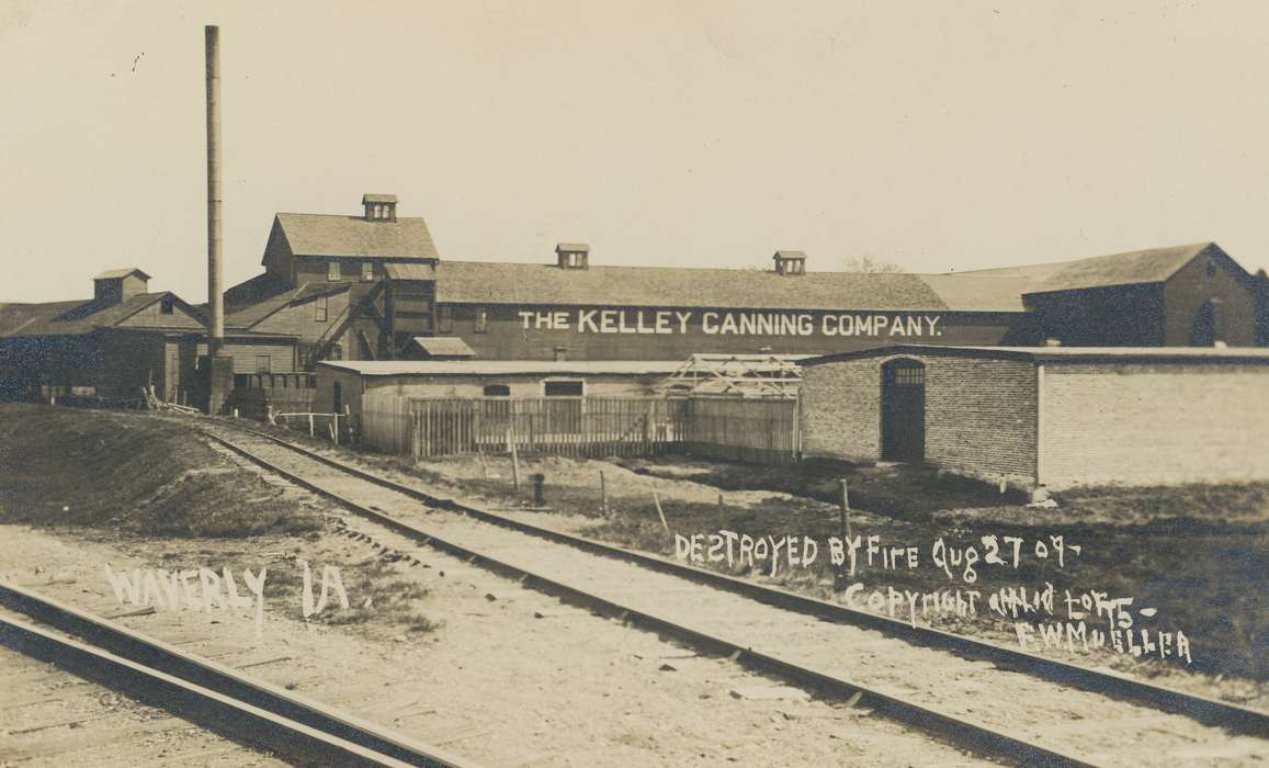 history of Iowa, Iowa History, factory, Businesses and Factories, railroad track, brick building, canning, wooden fence, Waverly, IA, smokestack, Iowa, correct date needed, Waverly Public Library