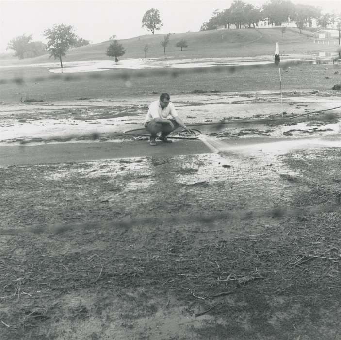 Floods, history of Iowa, Iowa History, summer, Waverly, IA, flood aftermath, water, man, Iowa, tree, Waverly Public Library, Labor and Occupations