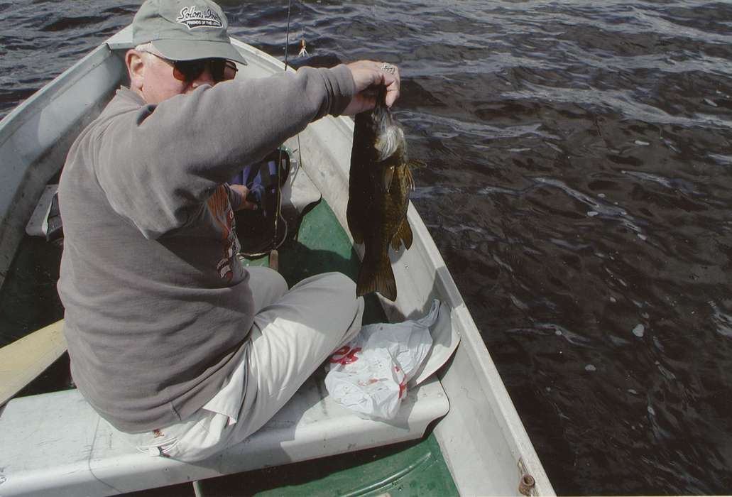 Travel, Haight, Jeannie, history of Iowa, Iowa History, Lakes, Rivers, and Streams, Canada, smallmouth bass, fishing, bass, man, Iowa, Outdoor Recreation, boat, Portraits - Individual