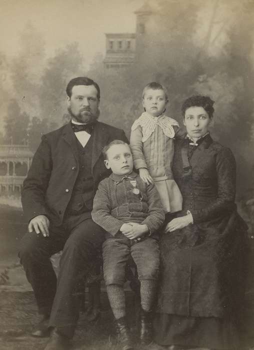 Portraits - Group, sack coat, cabinet photo, Iowa, mother, Families, Children, children, Jefferson, IA, Olsson, Ann and Jons, history of Iowa, father, family, lace collar, painted backdrop, brooch, bow tie, Iowa History