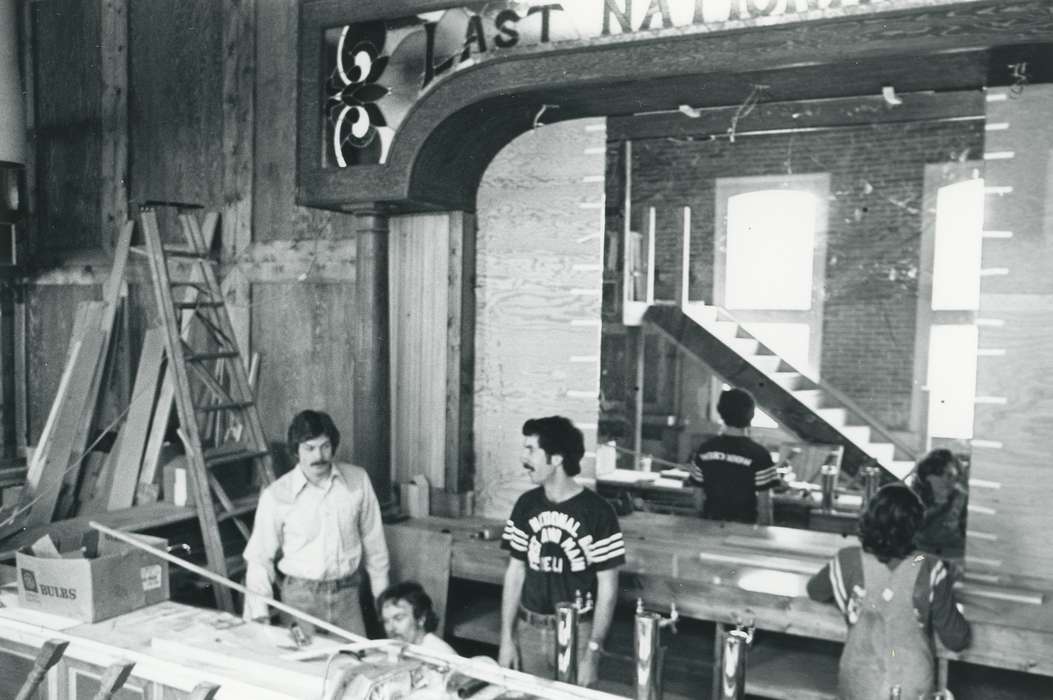 history of Iowa, Iowa History, construction, Businesses and Factories, remodeling, man, Iowa, moustache, stairs, ladder, overalls, Waverly Public Library, lumber, Labor and Occupations