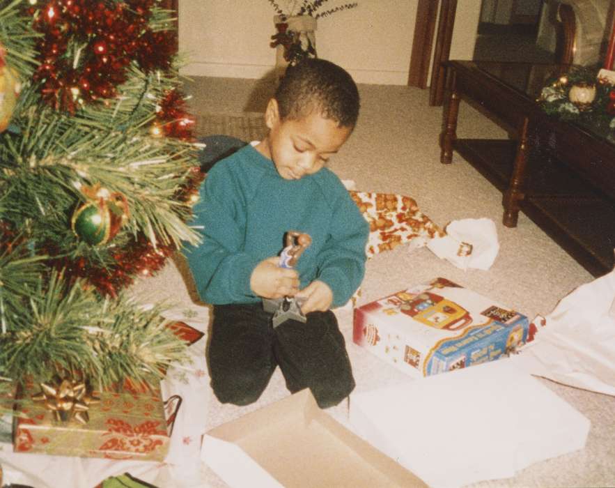 christmas presents, Waterloo, IA, african american, Barrett, Sarah, Homes, christmas, history of Iowa, christmas tree, Iowa, boy, Children, People of Color, Iowa History, presents, action figure, Holidays