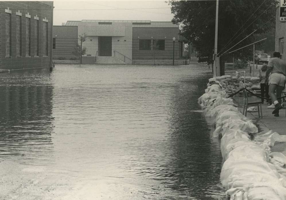 streetlights, Floods, history of Iowa, Iowa History, Motorized Vehicles, Businesses and Factories, Civic Engagement, brick building, Waverly, IA, Iowa, Cities and Towns, sandbagging, sandbag, Waverly Public Library
