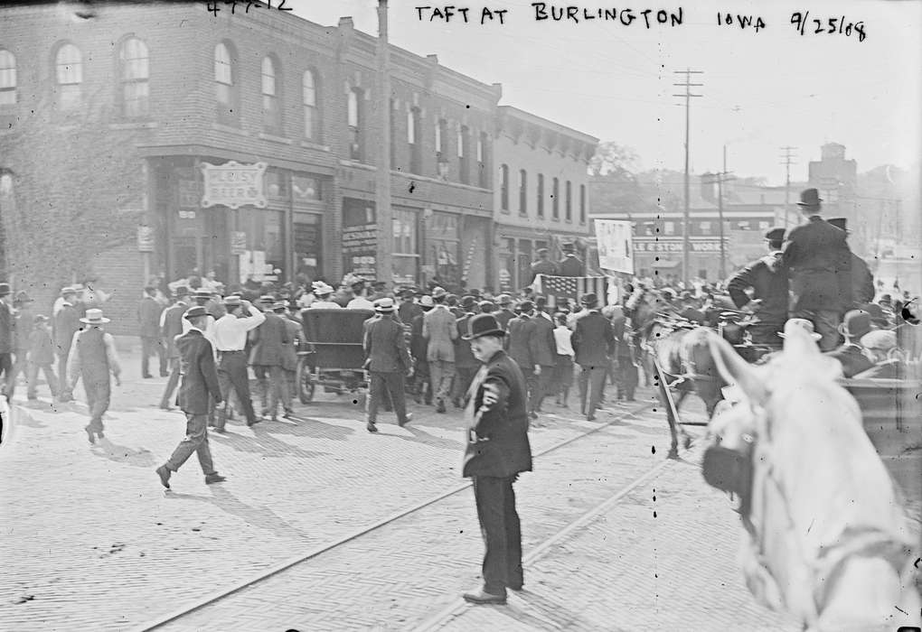 mainstreet, Main Streets & Town Squares, history of Iowa, Iowa History, suits, storefront, brick street, Businesses and Factories, Civic Engagement, Animals, Library of Congress, crowd, hats, Iowa, Cities and Towns, Leisure