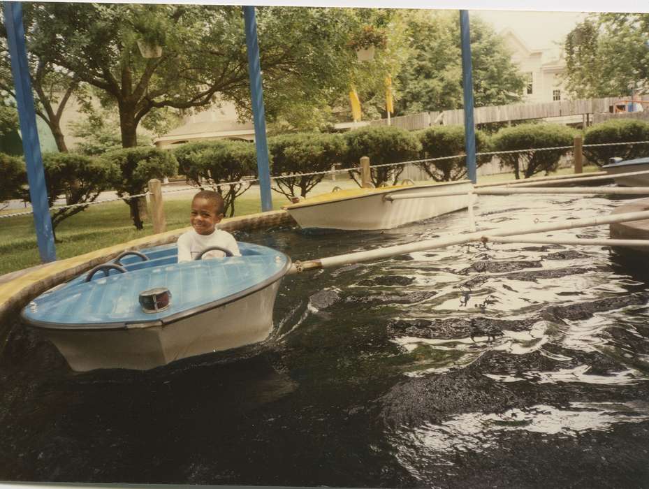 boy, Iowa, Altoona, IA, adventureland, Barrett, Sarah, Fairs and Festivals, Children, boat, african american, amusement ride, People of Color, Portraits - Individual, history of Iowa, amusement park, Iowa History