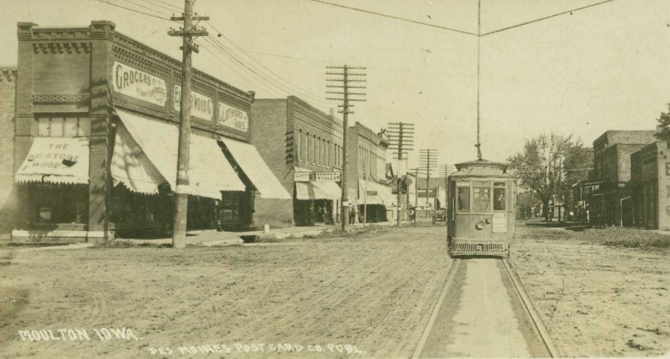 Iowa, street corner, trolley, Iowa History, restaurant, telephone pole, dirt road, Lemberger, LeAnn, Cities and Towns, history of Iowa, Moulton, IA, Motorized Vehicles, Main Streets & Town Squares, grocery store, street car