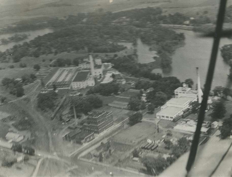 history of Iowa, Iowa History, carnation, Businesses and Factories, railroad track, Lakes, Rivers, and Streams, brick building, train track, Waverly, IA, cedar river, Aerial Shots, smokestack, Iowa, Waverly Public Library, train car