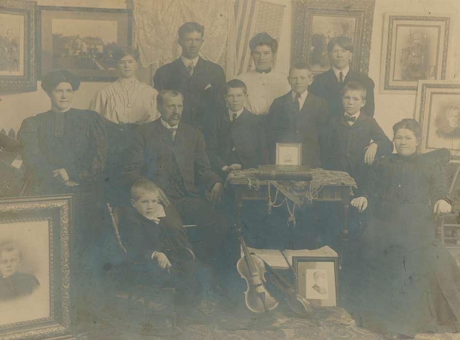 Portraits - Group, violin, bow tie, history of Iowa, Iowa History, Families, four in hand tie, book, woman, siblings, man, necklace, family, boy, Iowa, Waterloo, IA, Children, Shaulis, Gary