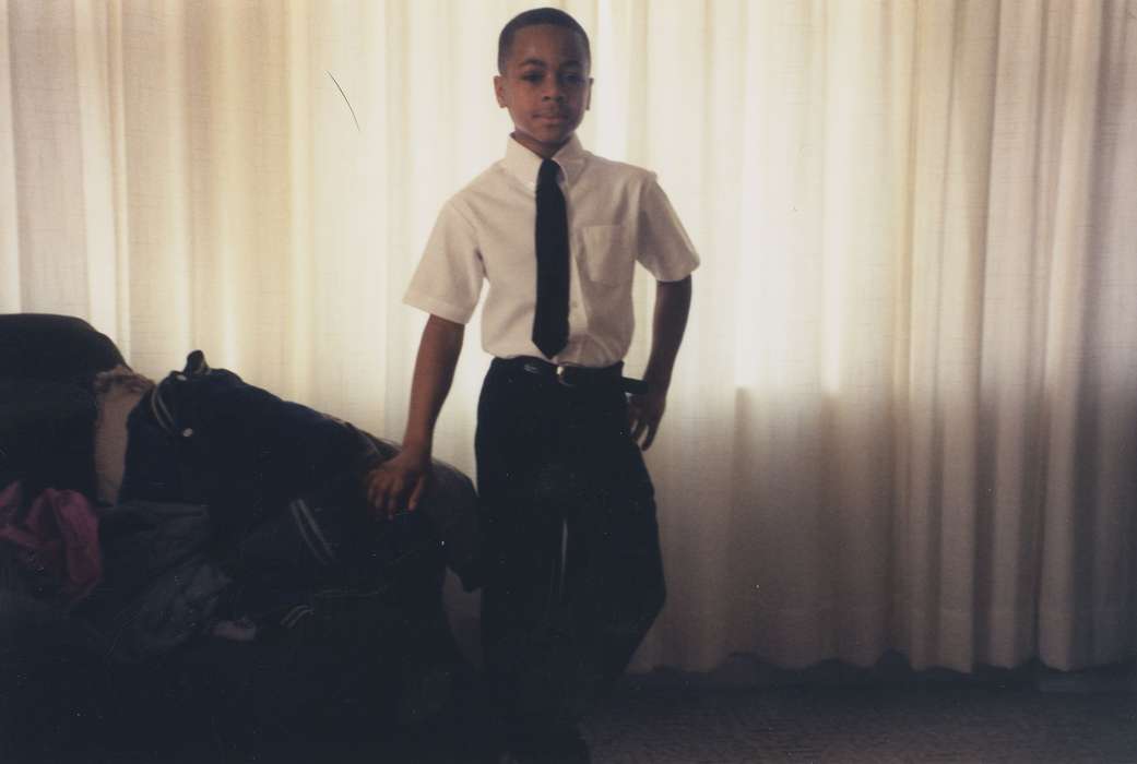 boy, curtain, Iowa, Barrett, Sarah, Waterloo, IA, Children, living room, african american, Homes, People of Color, Portraits - Individual, history of Iowa, necktie, Iowa History