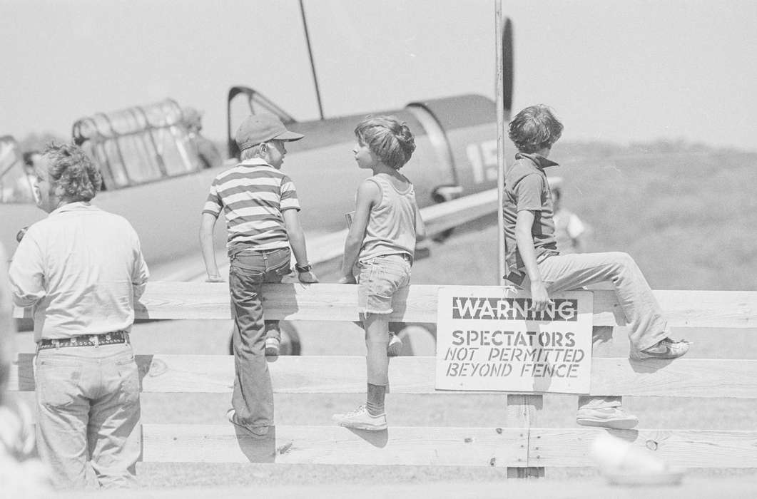 history of Iowa, plane, Ottumwa, IA, Entertainment, Iowa History, Lemberger, LeAnn, Motorized Vehicles, airplane, Iowa, fence, sign, Children, pilot