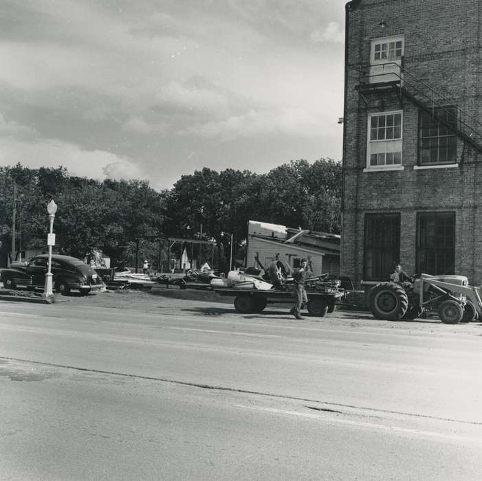 workers, Waverly, IA, street, Wrecks, brick building, Iowa, Businesses and Factories, street light, history of Iowa, debris, Motorized Vehicles, canning, car, correct date needed, Waverly Public Library, Labor and Occupations, Iowa History, flatbed trailer, tractor