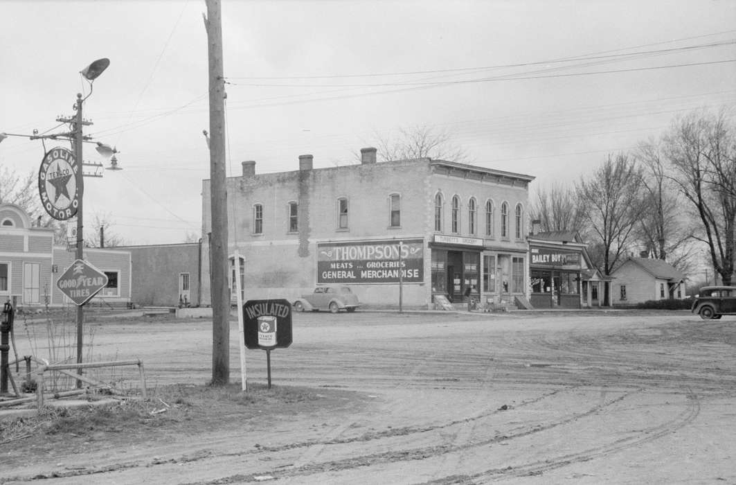 Library of Congress, electrical pole, history of Iowa, house, texaco, Businesses and Factories, grocery store, general store, dirt street, Iowa, Motorized Vehicles, brick building, Iowa History, pipeline, Cities and Towns, power lines, tree, cars