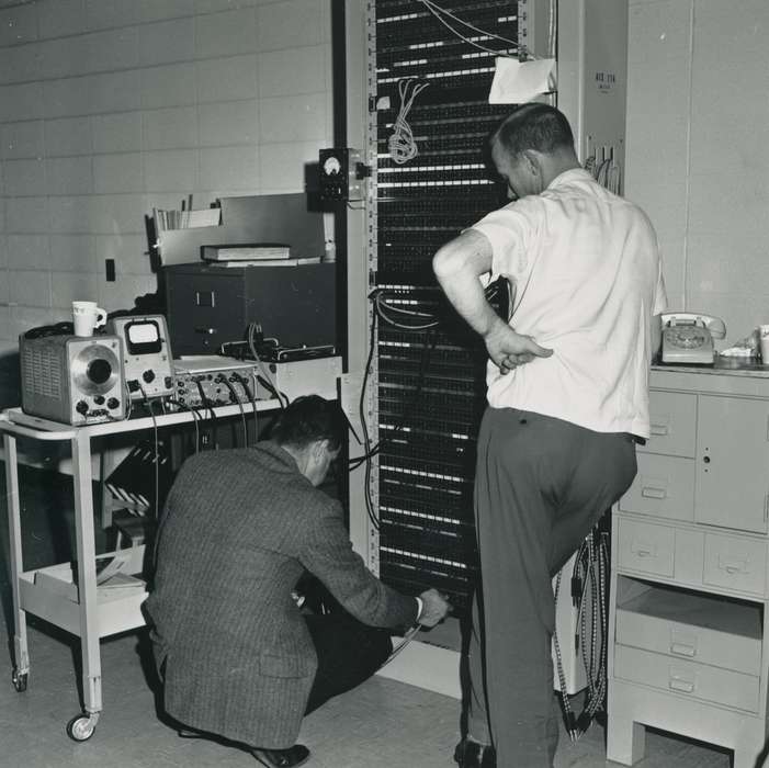 worker, telephone, file cabinet, Iowa History, history of Iowa, Businesses and Factories, equipment, cup, cart, Waverly, IA, Iowa, desk, building interior, Waverly Public Library, suit, Labor and Occupations