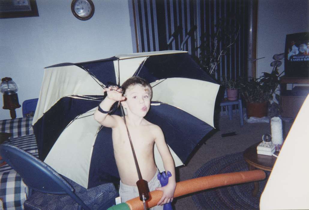 clock, house plant, Iowa, history of Iowa, IA, Leisure, chair, umbrella, television, rug, Portraits - Individual, Children, Iowa History, Scholtec, Emily, toy, living room