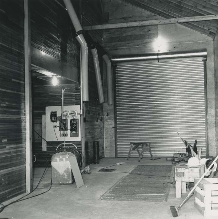 worker, Waverly Public Library, history of Iowa, Iowa History, Businesses and Factories, machinery, hard hat, garage, steel grate, Waverly, IA, Iowa, correct date needed, building interior, sawhorse, broom