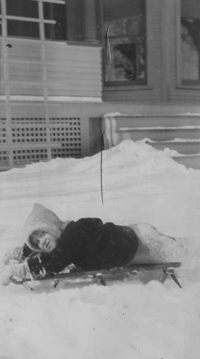 snowsuit, history of Iowa, snow, coat, front porch, yard, Iowa, Mullenix, Angie, sled, Children, Iowa History, Vinton, IA, Outdoor Recreation, Winter