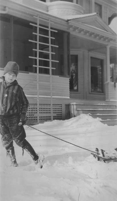 Outdoor Recreation, front porch, boots, Iowa, hat, coat, snow day, Children, snowsuit, homes, Mullenix, Angie, yard, Vinton, IA, Winter, history of Iowa, snow, Iowa History, sled