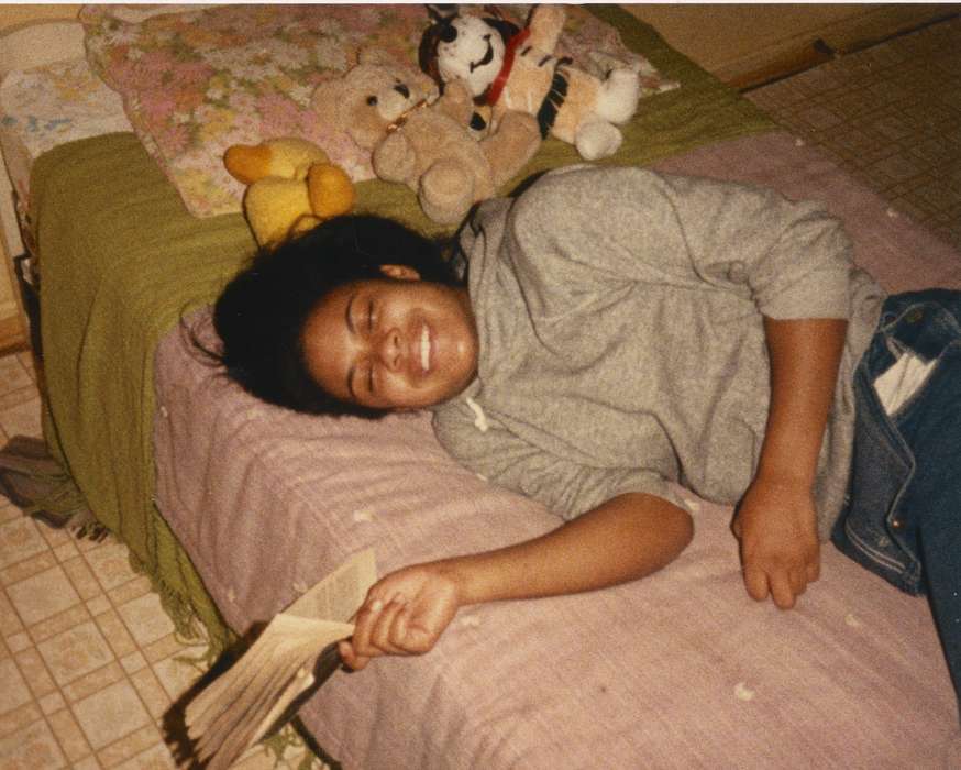 bedroom, teddy bear, bed, Waterloo, IA, Iowa, Barrett, Sarah, laughter, Leisure, Children, african american, Homes, People of Color, book, history of Iowa, Iowa History