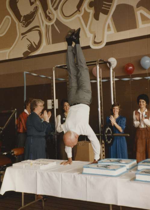 gym, cake, history of Iowa, Entertainment, celebration, Iowa History, Jones, Deb, Iowa, upside down, Cedar Rapids, IA, handstand