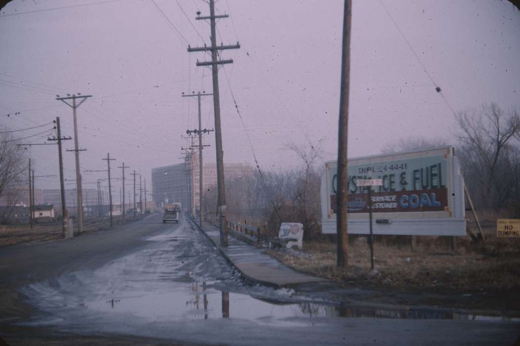 billboard, telephone pole, history of Iowa, advertisement, Sack, Renata, Iowa History, Winter, john deere, sidewalk, street corner, Iowa, duryea, Cities and Towns, utility pole, Waterloo, IA
