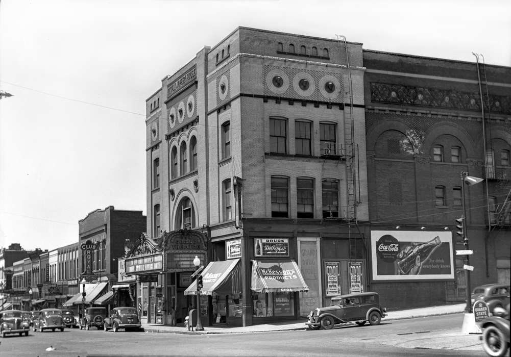 venue, window, architecture, Entertainment, bust, coca cola, Cities and Towns, Lemberger, LeAnn, history of Iowa, Motorized Vehicles, Main Streets & Town Squares, Iowa History, opera house, Iowa, Ottumwa, IA, marquee, advertisement, car, Businesses and Factories, opera, automobile