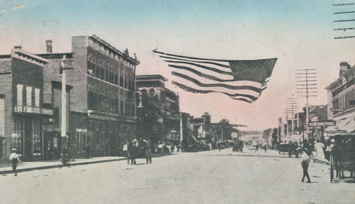 correct date needed, brick building, main street, Iowa, american flag, horse and buggy, Meyer, Sarah, history of Iowa, dirt road, Cities and Towns, Waverly, IA, utility pole, flag, Main Streets & Town Squares, Iowa History