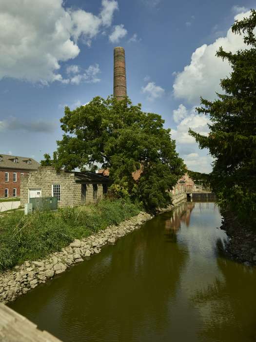 bridge, history of Iowa, creek, brick, canal, Library of Congress, Iowa History, Businesses and Factories, trees, Lakes, Rivers, and Streams, smoke stack, river, smokestack, Iowa, Cities and Towns, retaining wall, spillway