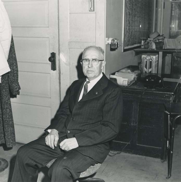 Waverly Public Library, telephone, history of Iowa, Iowa History, fettkether, Waverly, IA, pencil sharpener, glasses, radiator, man, office chair, desk, Iowa, businessman, correct date needed, hat, suit, Portraits - Individual