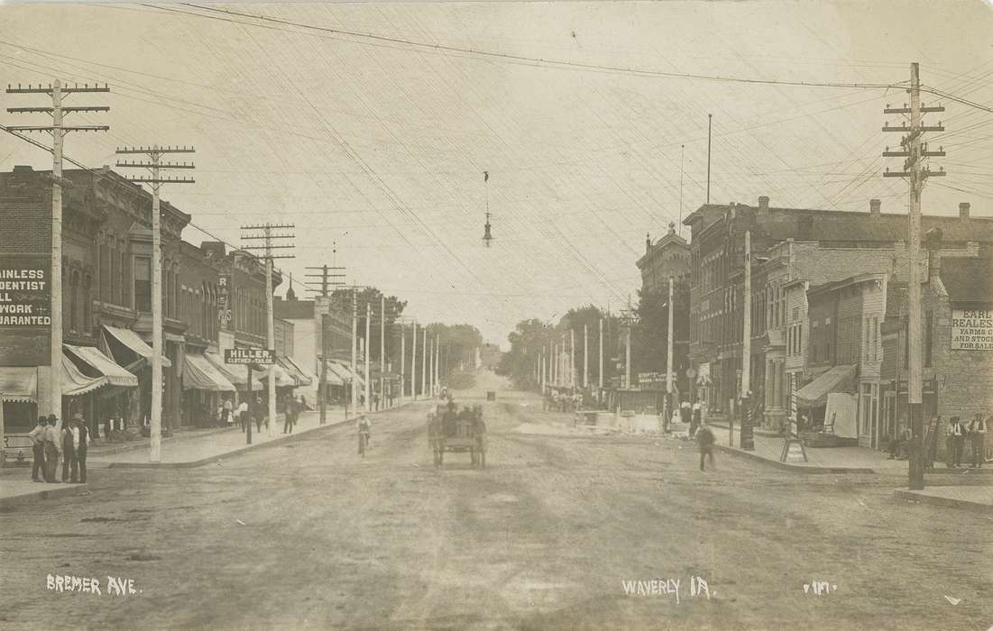 horse and cart, brick building, mainstreet, dentist, Iowa, Waverly Public Library, horse drawn wagon, clothing store, telephone poles, Businesses and Factories, history of Iowa, people, Waverly, IA, Main Streets & Town Squares, Iowa History