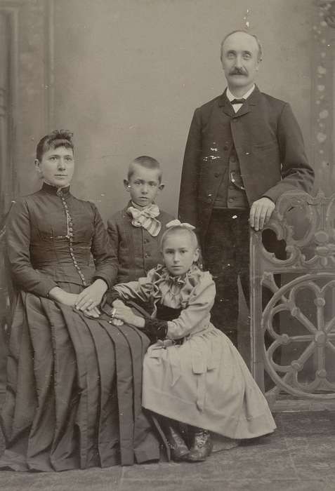 Portraits - Group, brother, sister, Iowa, mother, vest, high buttoned shoes, Families, Children, Olsson, Ann and Jons, history of Iowa, father, family, painted backdrop, bow tie, cabinet photo, Sumner, IA, Iowa History