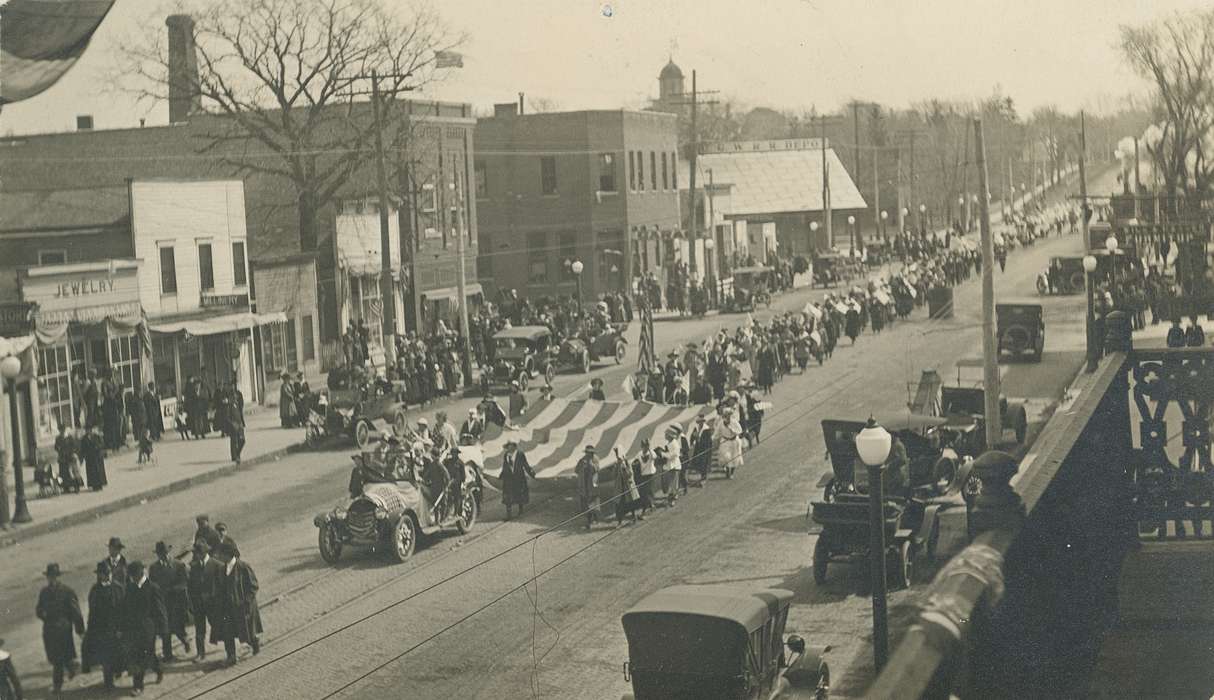 flag, Military and Veterans, Main Streets & Town Squares, main street, history of Iowa, Iowa History, military, Motorized Vehicles, Businesses and Factories, Civic Engagement, car, american flag, Waverly, IA, Iowa, Cities and Towns, Waverly Public Library, military parade