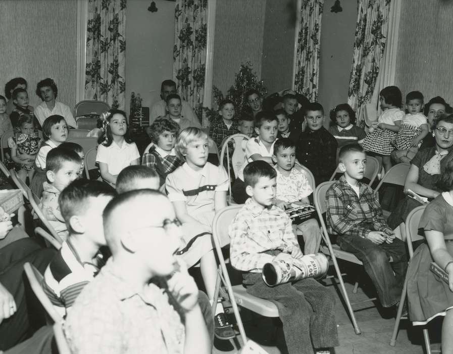 movie projector, history of Iowa, Iowa History, plaid shirt, Entertainment, film projector, christmas tree, mother, toy, Holidays, glasses, Iowa, curtain, Children, Waverly Public Library