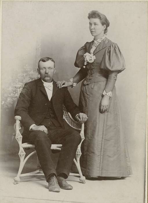 Portraits - Group, sack coat, wing tip collar, Iowa, Newton, IA, couple, chair, Families, corsage, Olsson, Ann and Jons, painted backdrop, marriage, history of Iowa, cabinet photo, wicker chair, Iowa History