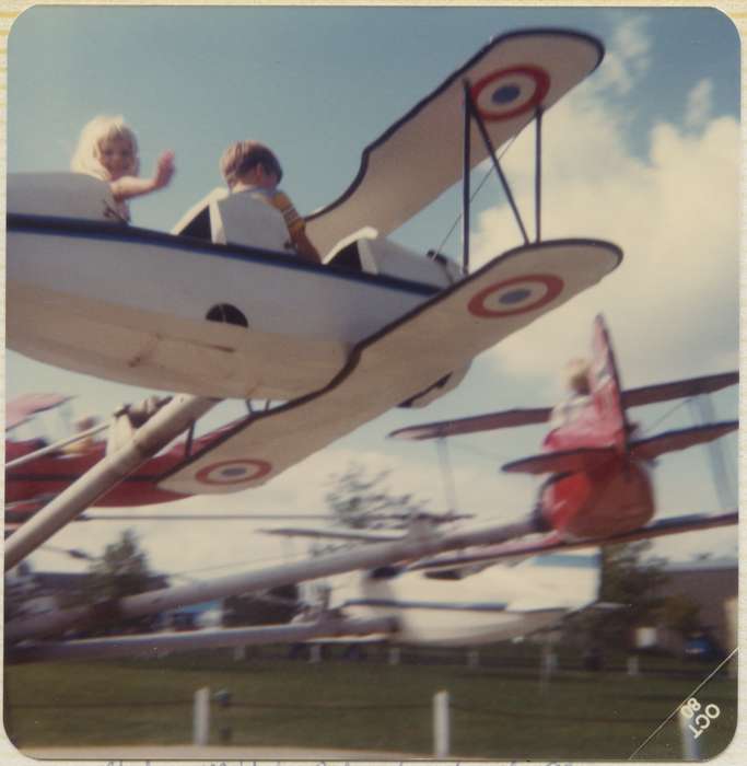 wave, history of Iowa, plane, amusement park, Entertainment, Iowa History, Harken, Nichole, amusment park ride, Fairs and Festivals, Iowa, Altoona, IA, Children, Portraits - Individual