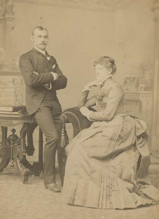 sack coat, bustle, history of Iowa, Iowa History, boutonniere, woman, couple, Olsson, Ann and Jons, man, cabinet photo, Iowa, painted backdrop, Davenport, IA, Religion