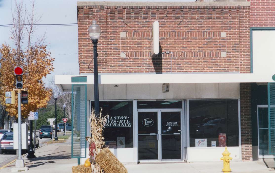 Cities and Towns, Iowa History, Waverly Public Library, Iowa, store front, Businesses and Factories, history of Iowa, street corner, insurance, mainstreet, Main Streets & Town Squares