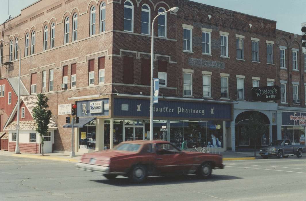 mainstreet, Main Streets & Town Squares, pharmacy, Iowa History, history of Iowa, storefront, Motorized Vehicles, Businesses and Factories, brick building, jewelry store, street corner, Iowa, Cities and Towns, Waverly Public Library