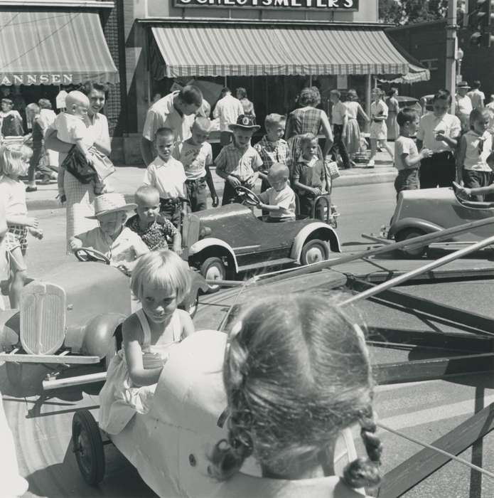 Children, history of Iowa, Waverly Public Library, Waverly, IA, Main Streets & Town Squares, Iowa, awning, carnival ride, crowd, Iowa History, correct date needed, Fairs and Festivals