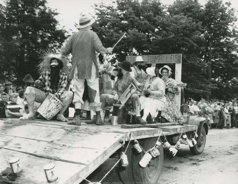 jug, plaid shirt, trash can, truck, stereotype, straw hat, mask, hat, Waverly Public Library, bonnet, history of Iowa, band, Iowa History, Entertainment, beard, Motorized Vehicles, bucket, washboard, crowd, can, costume, parade float, Iowa