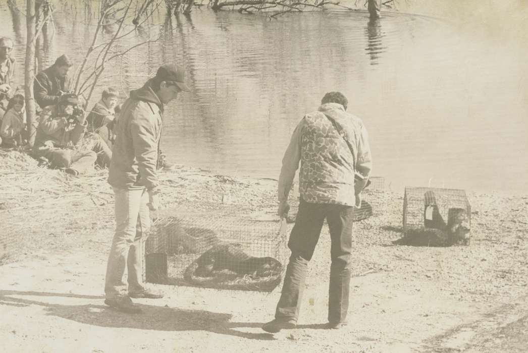 Children, coat, hat, water, history of Iowa, Waverly Public Library, Waverly, IA, tree, Iowa, Outdoor Recreation, otter, Iowa History, cage, Lakes, Rivers, and Streams, Animals, Labor and Occupations, photographer