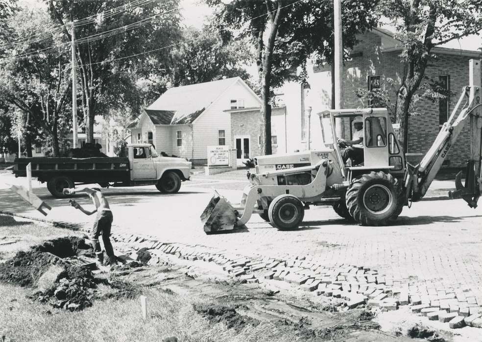 sign, truck, history of Iowa, Waverly Public Library, Waverly, IA, Iowa, heavy machinery, Motorized Vehicles, brick, brick road, road, building, Iowa History, worker, Labor and Occupations