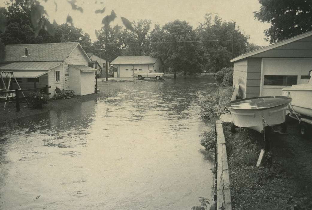 Floods, flooding, Iowa History, Cities and Towns, pickup truck, history of Iowa, Iowa, Outdoor Recreation, boat, Homes, Waverly Public Library, backyard