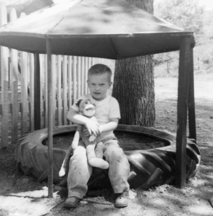 Iowa History, Edgewood, IA, Shaw, Marilyn, Children, Iowa, history of Iowa, Portraits - Individual, monkey, tire, stuffed animal, sandbox