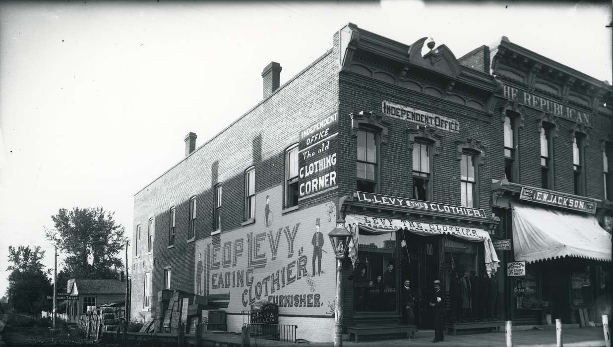 Portraits - Group, clothier, Iowa, Waverly Public Library, storefront, advertisement, clothing store, store, sign, Cities and Towns, Businesses and Factories, history of Iowa, Waverly, IA, Main Streets & Town Squares, Iowa History